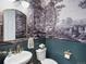 Stylish powder room features decorative wallpaper, elegant fixtures, and modern sink at 800 Boulder Peak Ave, Erie, CO 80516