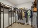 Walk-in closet with custom closet organizers and ample space for storage at 800 Boulder Peak Ave, Erie, CO 80516