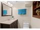 Bathroom with a vanity, mirror, decorative plant, stylish fixtures, and ample space at 10844 W 68Th Ave, Arvada, CO 80004