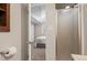 Bathroom featuring access to the bedroom with a glass-enclosed shower and neutral tones at 10844 W 68Th Ave, Arvada, CO 80004