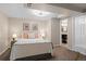 Cozy bedroom offers soft carpet, recessed lighting, and ensuite bathroom access for added convenience at 10844 W 68Th Ave, Arvada, CO 80004