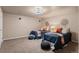 Carpeted bedroom offers two beds, recessed lighting, and accent décor for a comfortable living space at 10844 W 68Th Ave, Arvada, CO 80004