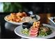 Tasty tuna steak salad and fried shrimp on a plate, offering a healthy and delicious restaurant meal at 10844 W 68Th Ave, Arvada, CO 80004
