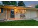 Charming home exterior features a well-maintained lawn and an inviting front entrance at 10844 W 68Th Ave, Arvada, CO 80004