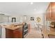 Bright kitchen area with stainless appliances and cozy dining nook at 10844 W 68Th Ave, Arvada, CO 80004