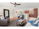 Cozy living room adjacent to the kitchen with hardwood floors and comfortable seating at 10844 W 68Th Ave, Arvada, CO 80004