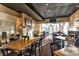 Spacious restaurant dining area with comfortable seating and a cozy fireplace at 10844 W 68Th Ave, Arvada, CO 80004