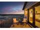 Cozy outdoor seating on a private balcony with evening sky at 8700 Lost Lake Dr, Franktown, CO 80116