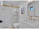 Modern bathroom with a glass shower enclosure, neutral colors, and a framed mirror at 8700 Lost Lake Dr, Franktown, CO 80116