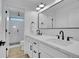Elegant bathroom showcasing dual sinks, modern fixtures, and a glass enclosed shower at 8700 Lost Lake Dr, Franktown, CO 80116