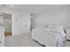 Bright bedroom with a glimpse into an adjoining bathroom, promoting a serene atmosphere at 8700 Lost Lake Dr, Franktown, CO 80116