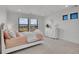 Comfortable bedroom with large windows offering scenic landscape views at 8700 Lost Lake Dr, Franktown, CO 80116