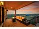 Inviting covered patio with comfortable seating and scenic views at 8700 Lost Lake Dr, Franktown, CO 80116