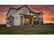 Beautiful two-story home featuring stone accents, a covered porch, and a two-car garage at 8700 Lost Lake Dr, Franktown, CO 80116