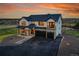 Stunning home featuring stone details, a two-car garage, and a well-maintained driveway at 8700 Lost Lake Dr, Franktown, CO 80116