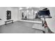 Home gym with mirrored wall, exercise equipment, and rubberized flooring at 8700 Lost Lake Dr, Franktown, CO 80116