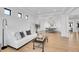 Bright, open living room features hardwood floors, white sofa, stylish decor, and lots of natural light at 8700 Lost Lake Dr, Franktown, CO 80116