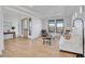 Bright living room featuring hardwood flooring, stylish furnishings, and scenic outdoor views through expansive windows at 8700 Lost Lake Dr, Franktown, CO 80116