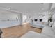 Bright and open living room featuring hardwood floors and a comfortable sectional sofa at 8700 Lost Lake Dr, Franktown, CO 80116