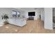 Open living room featuring a large sectional sofa, hardwood floors, and bright windows at 8700 Lost Lake Dr, Franktown, CO 80116
