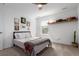 Cozy bedroom featuring a comfortable bed, natural light and shelf at 509 High Point Dr, Longmont, CO 80504