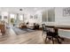Bright living room with hardwood floors, neutral color palette, and ample natural light from sliding glass doors at 509 High Point Dr, Longmont, CO 80504