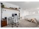 Bright playroom featuring desk, shelving, and carpeted floors at 509 High Point Dr, Longmont, CO 80504