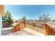 Newly built wooden deck overlooking a spacious backyard, perfect for outdoor entertaining and relaxation at 11813 Bellaire Cir, Thornton, CO 80233