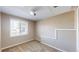 Bright bedroom featuring neutral carpet, and a window at 11813 Bellaire Cir, Thornton, CO 80233