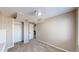 Well-lit bedroom featuring neutral carpet and closet at 11813 Bellaire Cir, Thornton, CO 80233