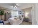 Comfortable bedroom with large window, dresser, and nightstands at 11813 Bellaire Cir, Thornton, CO 80233