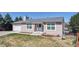 Charming single-story home with a well-maintained front yard, attached garage, and welcoming entryway at 11813 Bellaire Cir, Thornton, CO 80233
