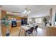 Spacious kitchen featuring wood cabinets, black appliances, a dining area, and lots of natural light at 11813 Bellaire Cir, Thornton, CO 80233