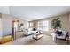 Bright living room featuring stylish furniture, modern decor, and plenty of natural light at 11813 Bellaire Cir, Thornton, CO 80233