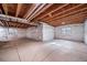 Large basement area, ready to be finished, with white wrapped walls at 14035 Touchstone St, Parker, CO 80134