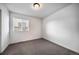 Carpeted bedroom featuring a window for natural light and ample space at 14035 Touchstone St, Parker, CO 80134