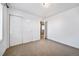 Bedroom featuring ample closet space and an open door to another room at 14035 Touchstone St, Parker, CO 80134