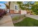 Charming two-story home with landscaped yard, sidewalk, driveway and a two car garage at 14035 Touchstone St, Parker, CO 80134