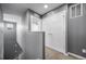 Hallway features neutral gray walls and white doors and trim, providing a modern aesthetic at 14035 Touchstone St, Parker, CO 80134