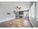 Spacious living room features hardwood floors, a fireplace, and large windows that provide natural light at 14035 Touchstone St, Parker, CO 80134