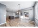Spacious living room with wood floors and an open layout to the kitchen with center island at 14035 Touchstone St, Parker, CO 80134