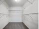 Spacious walk-in closet with multiple shelves, offering ample storage solutions at 14035 Touchstone St, Parker, CO 80134