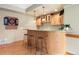 Entertainment area with a wooden bar, sink and seating for three at 29962 Troutdale Ridge Rd, Evergreen, CO 80439