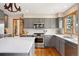 Modern kitchen featuring stainless steel appliances, an island, and ample counter space at 29962 Troutdale Ridge Rd, Evergreen, CO 80439