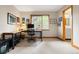 Bright office with large window, desk, and view of bathroom at 29962 Troutdale Ridge Rd, Evergreen, CO 80439