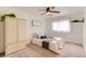 Bright bedroom with neutral carpet, built-in wardrobe, and a queen-sized bed with decorative pillows at 1601 Great Western Dr # D3, Longmont, CO 80501