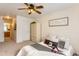 Cozy bedroom with carpet, decorative wardrobe, and queen bed adorned with stylish pillows at 1601 Great Western Dr # D3, Longmont, CO 80501