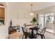 Charming dining room with a round table, four chairs, and sliding door to the outside at 1601 Great Western Dr # D3, Longmont, CO 80501