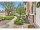 The side of this townhome features brick accents and tidy landscaping, enhancing curb appeal at 1601 Great Western Dr # D3, Longmont, CO 80501