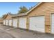 Detached garages offer private parking spaces, with a brick facade at 1601 Great Western Dr # D3, Longmont, CO 80501
